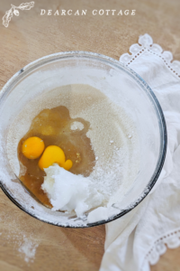 Bowl With eggs sugar and coconut oil