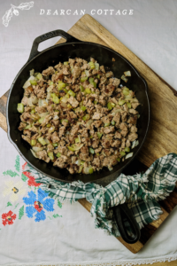 Breakfast Sausage on Cast Iron Pan With Onion and Celery
