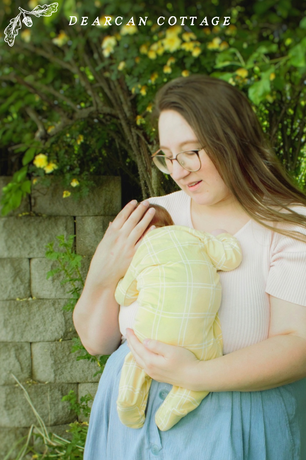 Newborn baby in the summer trees
